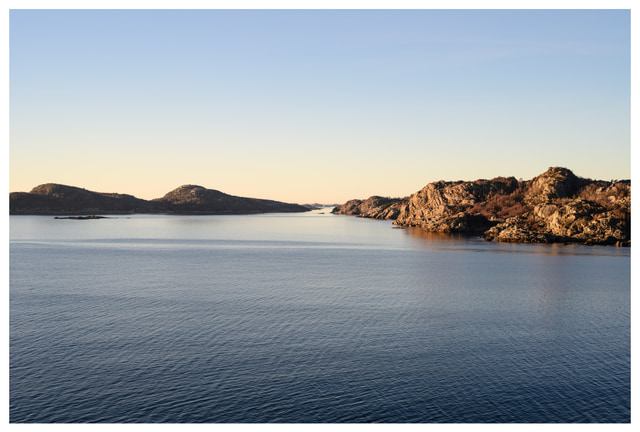 Wide coastal view from the top of Hausvikodden Fort, showing open sea and rocky shoreline.