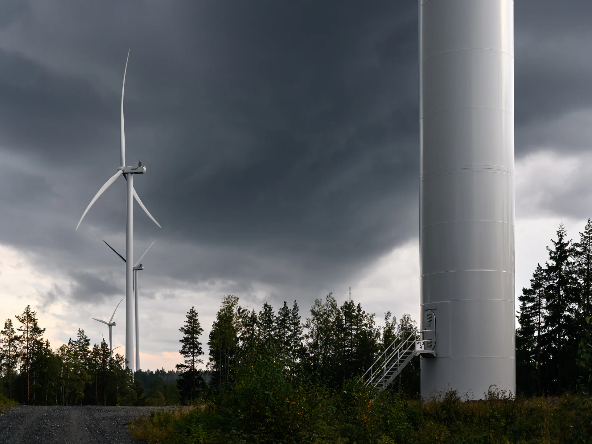 Windmills photography collection by Rino Falstad showing wind-turbine silhouettes in open landscape, blending movement and stillness.