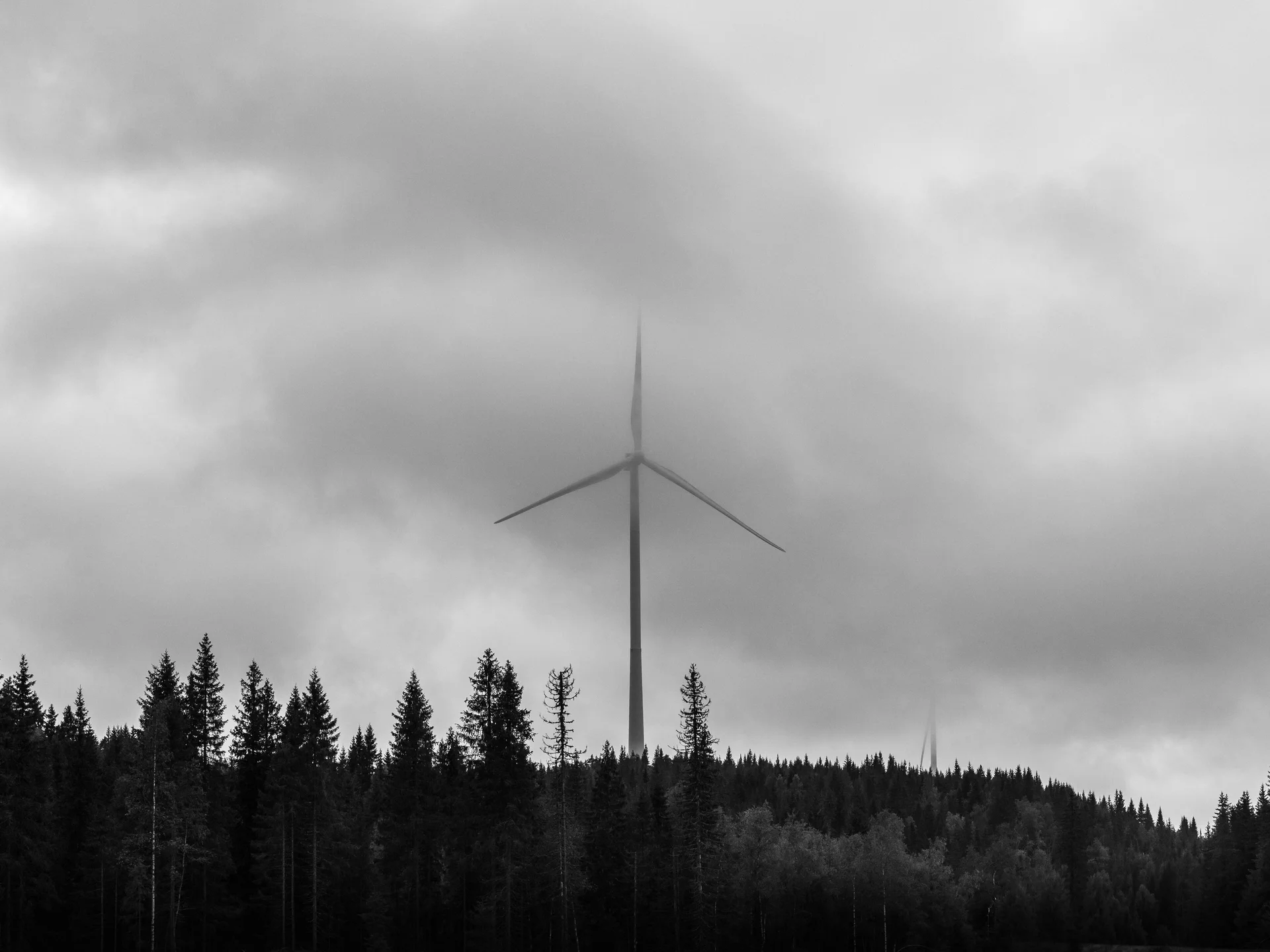 Windmills photography collection by Rino Falstad showing wind-turbine silhouettes in open landscape, blending movement and stillness.
